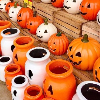 A row or ceramic jack-o-lanterns.